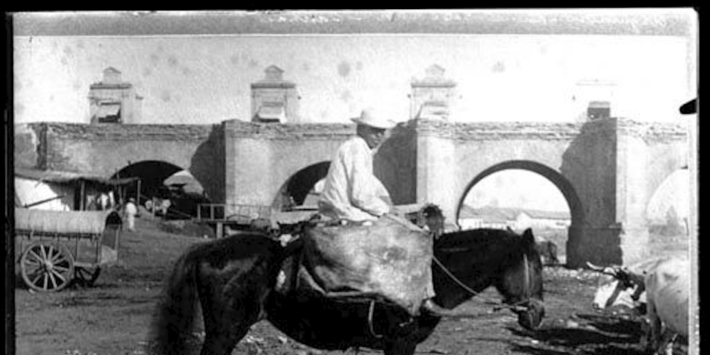 Hombre a caballo, atrás el puente Calicanto, ca. 1870